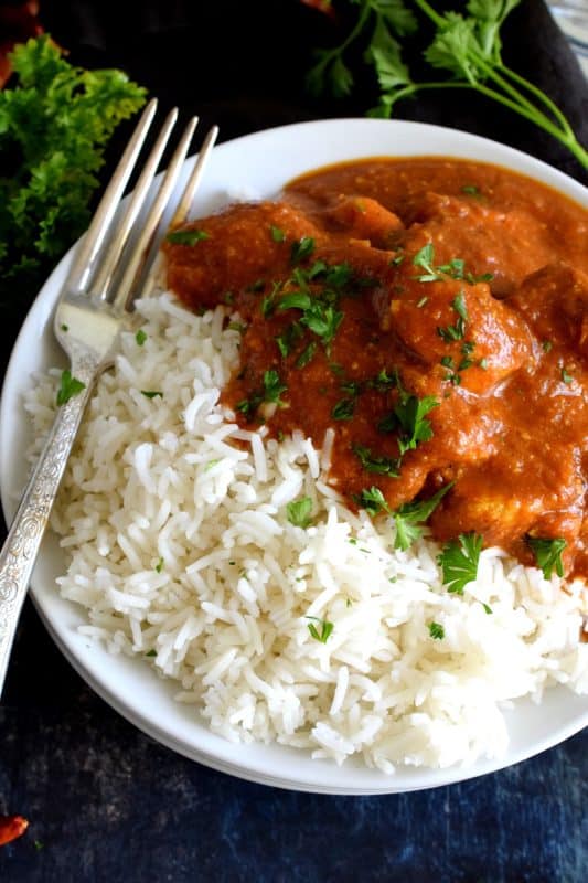 Tender chicken breast pieces, marinated in yogurt and spices, and simmered in a thick, luscious curry sauce. Why go out for Indian food when you can make Chicken Tikka Masala at home? Going out is so last year, anyway! #chicken #tikkamasala #indianchicken #indianathome #marinade #indianfood #indianrecipes