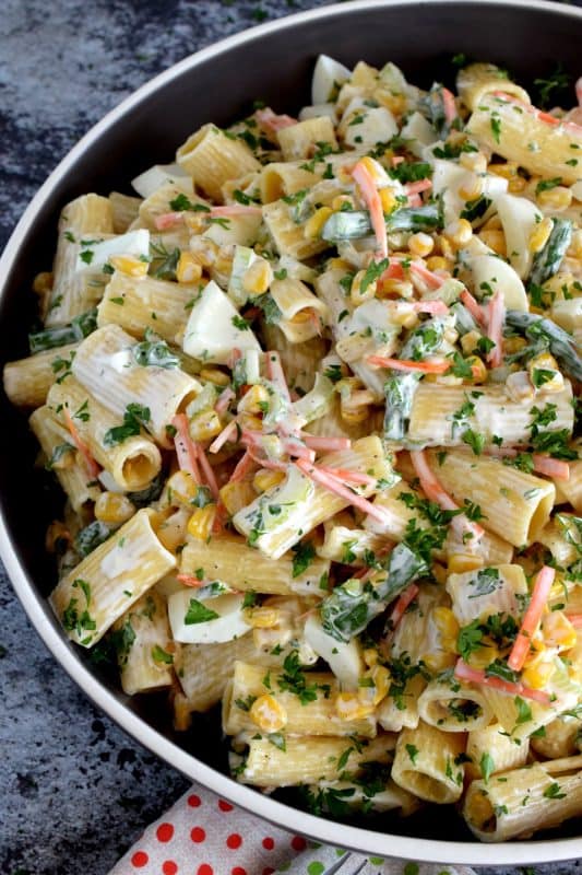 Served cold or at room temperature, Asparagus and Egg Pasta Salad is a dish best served in late spring or early summer when fresh asparagus is readily available. Bring this dish to your next picnic or potluck and you'll surely be the belle of the ball! #asparagus #egg #salad #pasta #fresh #picnic #summer #potluck