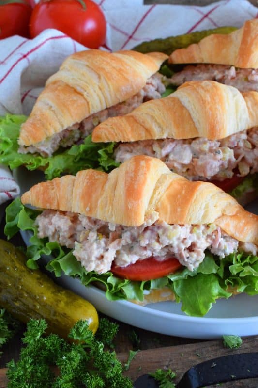 There's a time for the ease of store-bought thinly sliced deli meat, and then there's a time for a homemade deviled ham salad piled high onto fresh croissants with crisp, leafy lettuce, and thick slices of the brightest and freshest red tomatoes. So, do you want fast and easy, or do you want fast, easy, fresh, and delicious? #deviled #ham #croissant #hamsandwich #deviledham