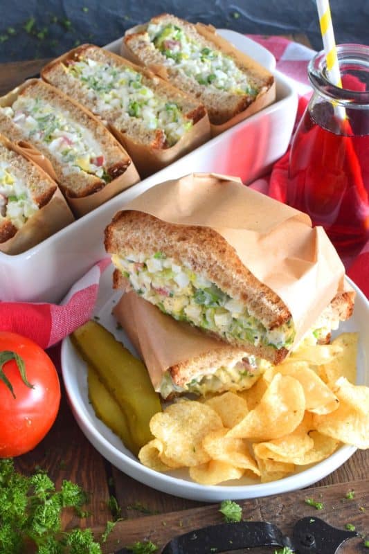 Take this Irish Egg Salad Sandwich to work with you for lunch this St. Patrick's Day! It's the most delicious and interesting egg salad sandwich you'll ever eat! It is super flavourful and filled with freshness too. Get your favourite sandwich bread and overfill it with this egg salad mixture; if it's not messy, you're not doing it right! #eggsalad #sandwich #eggsandwich #irish #stpatricksday #eggsaladsandwich #vegetarian