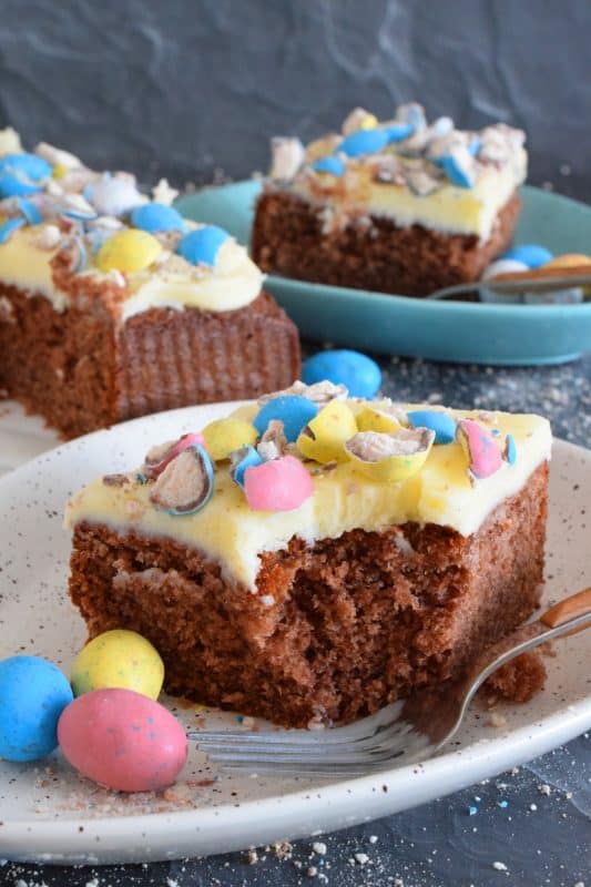 This Easter Whoppers Cake is light and fluffy, yet moist and flavourful, and prepared with chocolate pudding! The cake is topped with buttercream frosting and crushed whoppers. If you have never tried a cake made with pudding, you're in for a treat! This is the ultimate Easter Sunday dessert! #whoppers #easter #desserts #cake #chocolate #pudding #eastercake