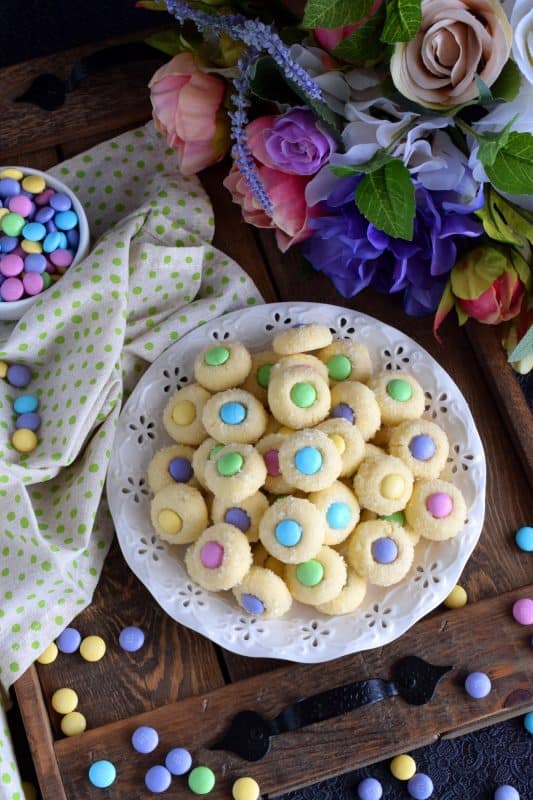 Miniature, one-bite cookies made with pastel candy centers. Easter Bunny Button Cookies are a great Easter gift idea, and can be easily packaged for gift-giving, or just save them all for yourself! Whatever you decide, a double batch just might be a good idea! #easter #bunny #cookies #candy #chocolate