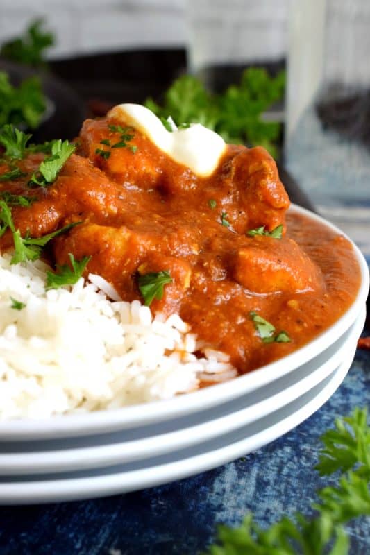 Tender chicken breast pieces, marinated in yogurt and spices, and simmered in a thick, luscious curry sauce. Why go out for Indian food when you can make Chicken Tikka Masala at home? Going out is so last year, anyway! #chicken #tikkamasala #indianchicken #indianathome #marinade #indianfood #indianrecipes