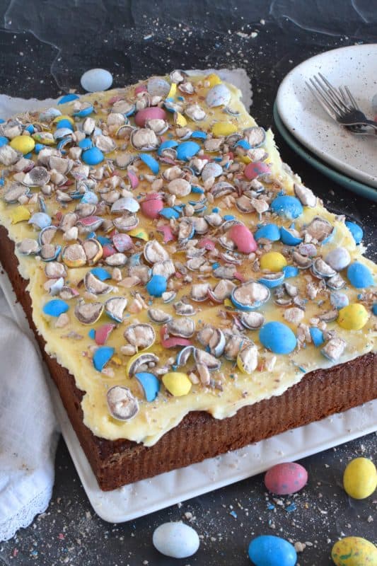 This Easter Whoppers Cake is light and fluffy, yet moist and flavourful, and prepared with chocolate pudding! The cake is topped with buttercream frosting and crushed whoppers. If you have never tried a cake made with pudding, you're in for a treat! This is the ultimate Easter Sunday dessert! #whoppers #easter #desserts #cake #chocolate #pudding #eastercake