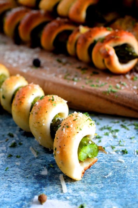 Whether you're looking for a new side dish or an interesting appetizer, Wrapped Asparagus with Garlic Butter and Parmesan is the answer. Perfectly baked, perfectly seasoned, and perfectly perfect! Serve hot or at room temperature! #asparagus #wrapped #appetizer #homemade #dough #biscuit #dip #baked #roasted