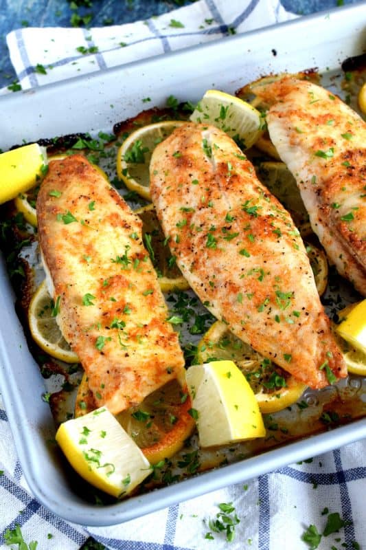 Classic fish recipe ingredients like lemon and garlic come together with the help of sriracha to create a baked tilapia worthy of the highest praise. Boring fish recipes be gone; say hello to Sriracha Lemon Garlic Tilapia! #tilapia #lemongarlic #bakedfish #bakedtilapia
