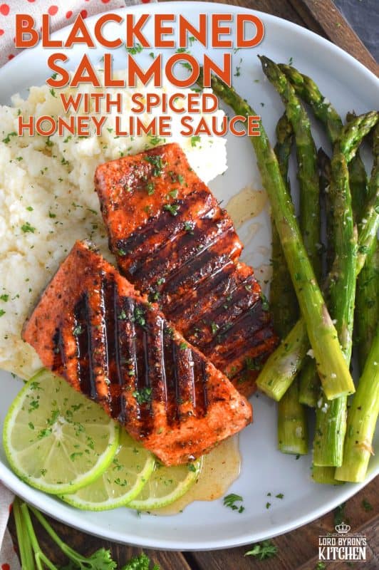 Salmon fillets are liberally dusted with an easy to make homemade blackening seasoning and grilled over high heat to get those prominent grill marks. Once plated, the salmon is drizzled with an optional spiced honey lime sauce. Simple and easy, yet gorgeous and delicious, this is not your average salmon dinner! #blackened #salmon #grilledsalmon #grillingrecipes #30minutemeals