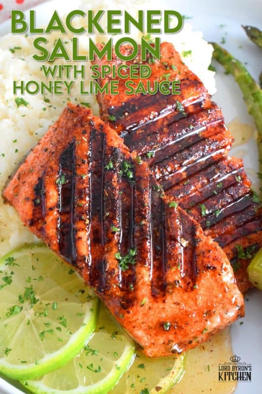 Salmon fillets are liberally dusted with an easy to make homemade blackening seasoning and grilled over high heat to get those prominent grill marks. Once plated, the salmon is drizzled with an optional spiced honey lime sauce. Simple and easy, yet gorgeous and delicious, this is not your average salmon dinner! #blackened #salmon #grilledsalmon #grillingrecipes #30minutemeals
