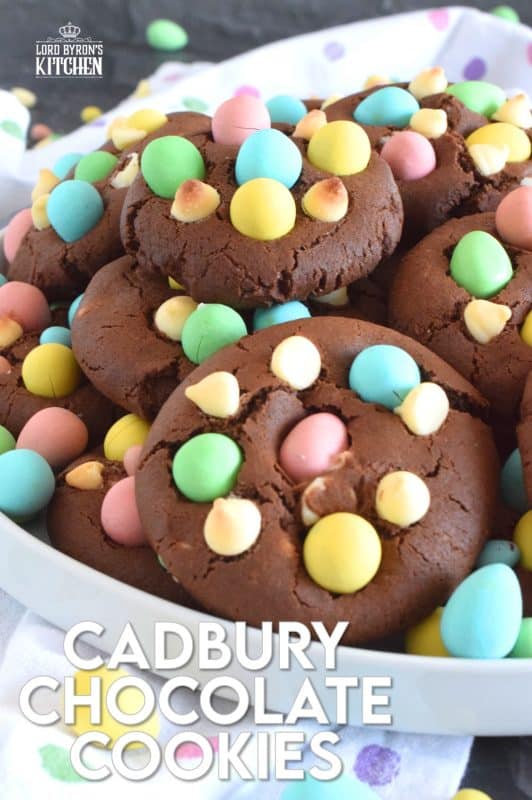Cadbury Chocolate Cookies are slightly crispy on the outside, with a moist and dense chocolaty center. Stuffed with white chocolate chips and topped with chocolate mini eggs, these are substantial cookies, meaning that they are thick and filling. Great for dunking in a glass of cold milk too! #cadbury #minieggs #easter #cookies #chocolate