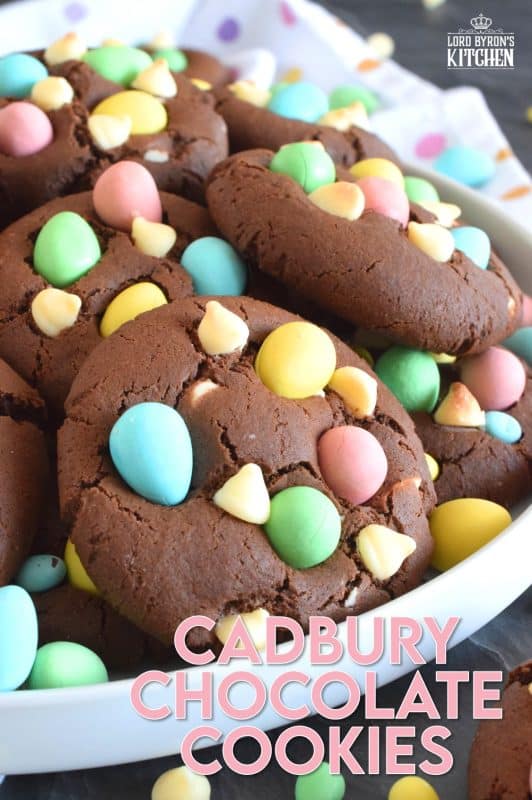 Cadbury Chocolate Cookies are slightly crispy on the outside, with a moist and dense chocolaty center. Stuffed with white chocolate chips and topped with chocolate mini eggs, these are substantial cookies, meaning that they are thick and filling. Great for dunking in a glass of cold milk too! #cadbury #minieggs #easter #cookies #chocolate
