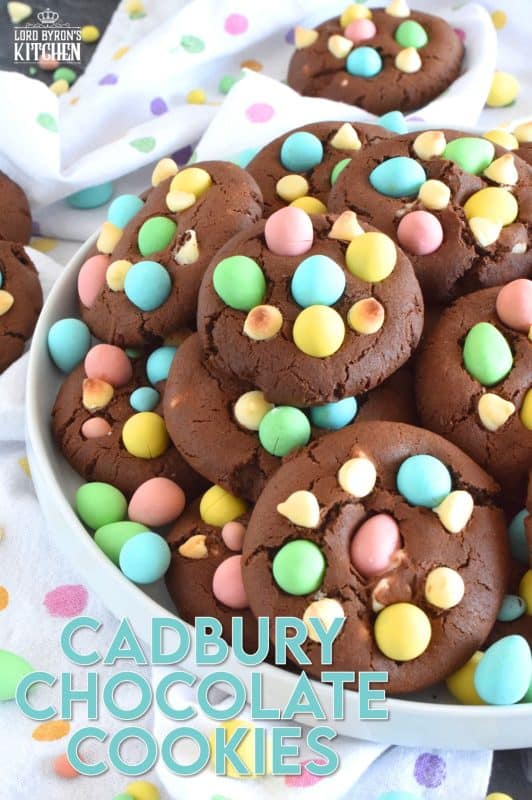 Cadbury Chocolate Cookies are slightly crispy on the outside, with a moist and dense chocolaty center. Stuffed with white chocolate chips and topped with chocolate mini eggs, these are substantial cookies, meaning that they are thick and filling. Great for dunking in a glass of cold milk too! #cadbury #minieggs #easter #cookies #chocolate