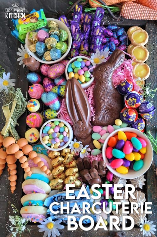 Gather together all of your Easter basket goodies and assemble an Easter Charcuterie Board for your friends and family. It's such an easy way to serve up dessert after dinner, because everything is ready to go, and there's no mess or fuss. All you need is a bunch of napkins and cups of hot coffee for everyone because coffee and chocolate cannot be beat! #charcuterie #easterchocolate #easter #eastercharcuterie #chocolate #bunnies