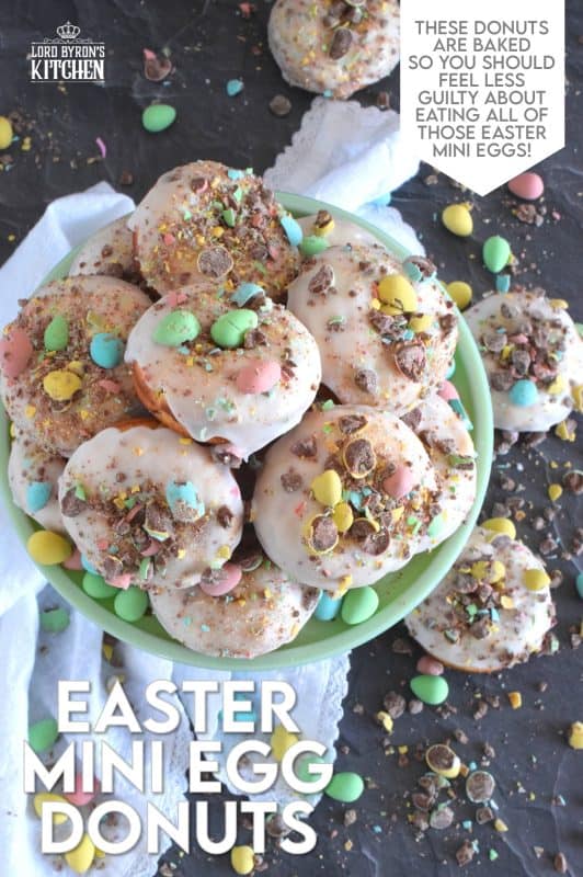 When it comes to donuts, chocolate is always a great choice. Easter Mini Egg Donuts are prepared with a vanilla batter, loaded with crushed Cadbury mini eggs, topped with a simple sugar glaze, and more crushed mini eggs! Easter treats never tasted so good! #donuts #bakeddonuts #doughnuts #easter #cadbury #minieggs