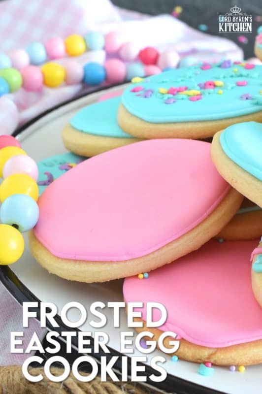 Frosted Easter Egg Cookies are prepared with a light and airy shortbread cookie base consisting of only three ingredients! Once cooled, they are frosted with an easy-to-make royal icing, which hardens and crisps when dried. Topped with sprinkles or simply frosted with whimsical patterns, it's hard to eat only one of these cookies! #easter #easteregg #cookies #royalicing #frosted #sprinkles #cookiecutter
