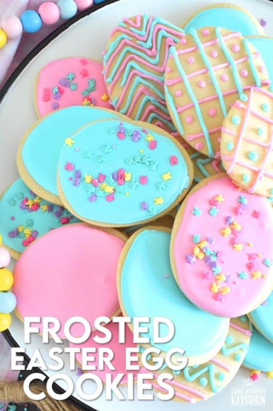 Frosted Easter Egg Cookies are prepared with a light and airy shortbread cookie base consisting of only three ingredients! Once cooled, they are frosted with an easy-to-make royal icing, which hardens and crisps when dried. Topped with sprinkles or simply frosted with whimsical patterns, it's hard to eat only one of these cookies! #easter #easteregg #cookies #royalicing #frosted #sprinkles #cookiecutter