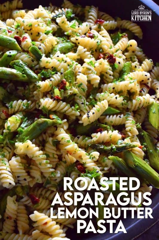 A dish that can only be described as springtime in a bowl, this simple butter roasted asparagus pasta salad, tossed with sun dried tomatoes, fresh lemon, and parmesan. A delightful cold pasta salad that everyone will love! #asparagus #lemon #butter #pasta #salad