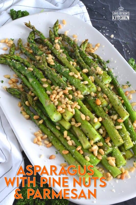 This side dish is great any time, but is best when fresh asparagus is in season. Roasted Asparagus with Pine Nuts and Parmesan has perfectly cooked asparagus with the saltiness of freshly grated parmesan and the nuttiness of delicately toasted pine nuts. Super fast, super yummy, and super easy! #asparagus #pinenuts #parmesan #roasted #sidedish