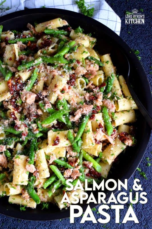 Served warm or hot, Salmon and Asparagus Pasta Salad is a complete meal with so much flavour and texture! The fresh asparagus, lemon juice, and freshly grated parmesan cheese come together to elevate the inexpensive and humble canned flaked salmon! #canned #salmon #asparagus #salad #costco