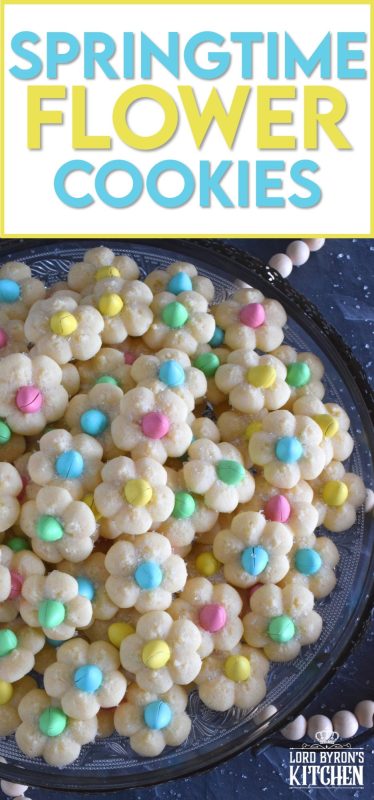 A good spritz cookie should taste slightly sweet and buttery. The cookie should be slightly crumbly, but not dry, and it should feel like it’s melting in your mouth. Topped with a single candy-coated chocolate, these Springtime Flower Cookies are not only delicious but pretty and cheerful too! #spritz #cookies #easter #spring #flower #cadbury #minieggs