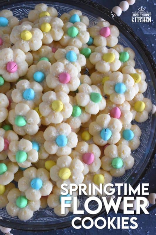A good spritz cookie should taste slightly sweet and buttery. The cookie should be slightly crumbly, but not dry, and it should feel like it’s melting in your mouth. Topped with a single candy-coated chocolate, these Springtime Flower Cookies are not only delicious but pretty and cheerful too! #spritz #cookies #easter #spring #flower #cadbury #minieggs
