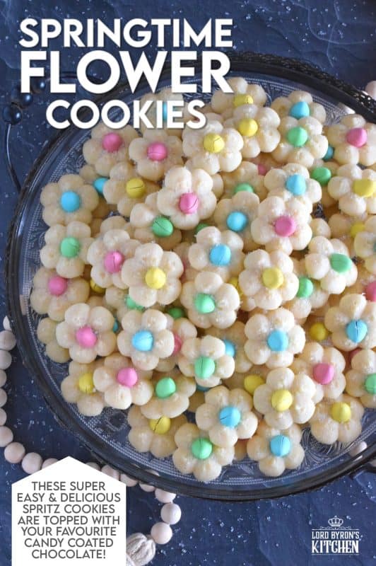 A good spritz cookie should taste slightly sweet and buttery. The cookie should be slightly crumbly, but not dry, and it should feel like it’s melting in your mouth. Topped with a single candy-coated chocolate, these Springtime Flower Cookies are not only delicious but pretty and cheerful too! #spritz #cookies #easter #spring #flower #cadbury #minieggs
