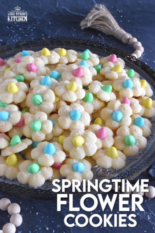A good spritz cookie should taste slightly sweet and buttery. The cookie should be slightly crumbly, but not dry, and it should feel like it’s melting in your mouth. Topped with a single candy-coated chocolate, these Springtime Flower Cookies are not only delicious but pretty and cheerful too! #spritz #cookies #easter #spring #flower #cadbury #minieggs