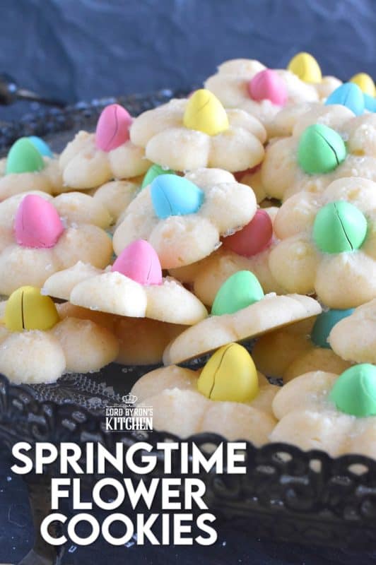 A good spritz cookie should taste slightly sweet and buttery. The cookie should be slightly crumbly, but not dry, and it should feel like it’s melting in your mouth. Topped with a single candy-coated chocolate, these Springtime Flower Cookies are not only delicious but pretty and cheerful too! #spritz #cookies #easter #spring #flower #cadbury #minieggs