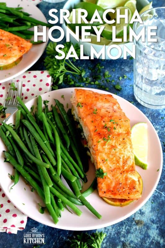 Slightly sweet with a little tartness, Sriracha Honey Lime Salmon is oven baked on a bed of sliced limes for extra zing and fresh flavour. The sriracha and honey combine to make a wonderful basting sauce with the perfect balance of sweet and heat. #sriracha #honey #honeylime #salmon #bakedsalmon #spicysalmon