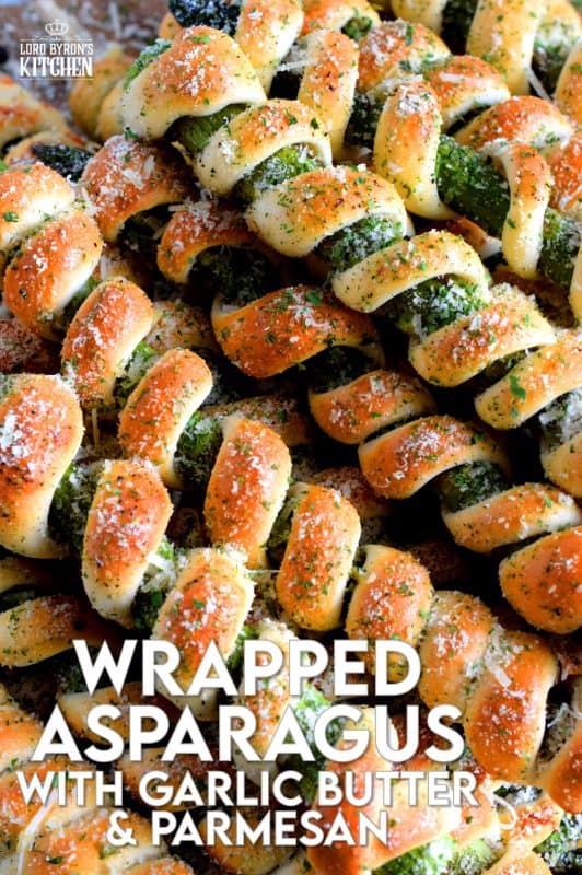 Whether you're looking for a new side dish or an interesting appetizer, Wrapped Asparagus with Garlic Butter and Parmesan is the answer. Perfectly baked, perfectly seasoned, and perfectly perfect! Serve hot or at room temperature! #asparagus #wrapped #appetizer #homemade #dough #biscuit #dip #baked #roasted