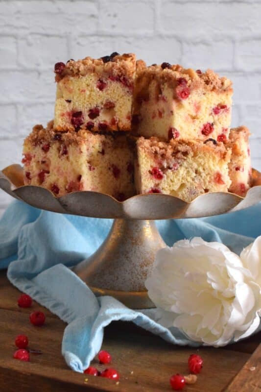 With two whole cups of red currants, and lemon zest, this Currant Coffee Cake tastes tangy, sweet, and very refreshing. With a sweet walnut crumb topping, this is one cake that should be served with a hot tea or coffee. #coffeecake #redcurrants #currants #berries #cake