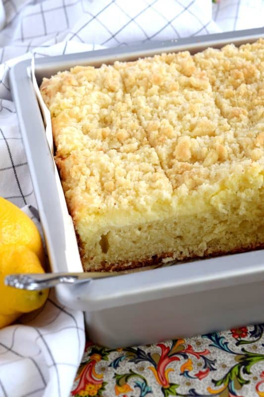 Lemon Cream Cheese Coffee Cake is extra lemony, with a creamy filling and a crumbly topping. Light, refreshing, and delicious; brew the coffee and invite your friends! That's assuming you'll want to share this cake with anyone after you get your first taste! #lemon #coffee #cake #cream #cheese #dessert #summer