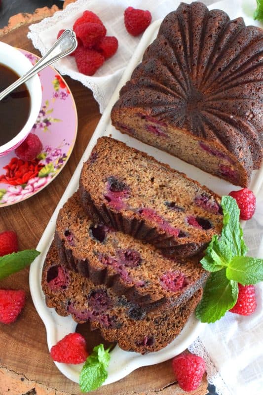 Loaded with fresh raspberries, this Raspberry Banana Loaf is the most moist and delicious loaf ever! Prepared with only a bowl and a spatula; no sifting or adding ingredients one at a time. Dump everything in a bowl, stir to combine, and bake. A loaf like this needs no frosting or fussing; serve thick slices with a hot tea or coffee! #banana #loaf #bread #raspberry #baking #raspberryloaf #onebowl