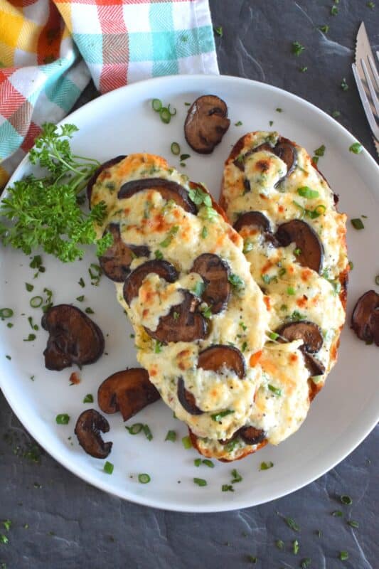 Sometimes you want something quick, easy, and filling. And, sometimes, you want something that is all of those things, as well as cheesy, messy, and loaded with carbs. Four Cheese Mushroom Toasts is just what you need! It's one of those great weeknight dinners that just makes you feel all warm and cozy! #mushroom #cheese #cheesy #toast #toasts #makeitameal