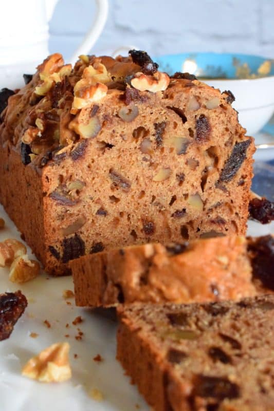 Best served with tea as an afternoon snack, Date Walnut Loaf is very moist with bursts of sweet chopped dates and crunchy walnuts. Makes for a great gift idea, and can be easily frozen for later too! #dates #walnut #loaf #medjool #bread