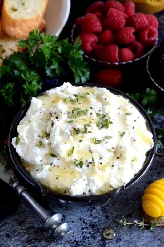 Whipped Goat Cheese is best when served on warm, grilled bread and topped with fresh fruit or sliced veggies. A drizzle of honey makes it just perfect! #cheese #goatcheese #whipped #appetizer #dip