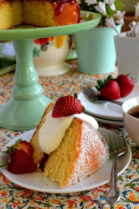 This gorgeous, easy-to-prepare, homemade Jam Filled Vanilla Layer Cake is not only delicious but also quite impressive! Although basic and rustic in presentation, this cake looks like a million bucks! No cake-decorating skills are needed for this beautiful showpiece! And, as a bonus, you can use your favourite jam flavour too! #jam #filling #cake #vanilla #easy #center