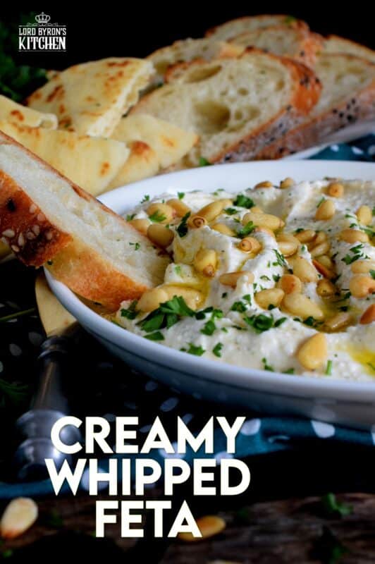 Salty and velvety smooth, seasoned with pantry herbs and spices, Creamy Whipped Feta will satisfy all of your snack cravings. Smear it on crackers and bread, or use it as a dip with veggies or pita. For even more flavour, be sure to toast the pine nuts first! #feta #fetadip #whippedfeta #dip #spread #appetizer