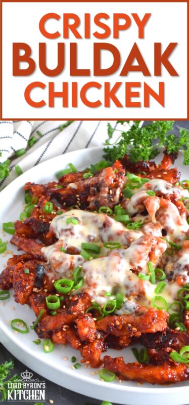 This crispy chicken is a Korean-inspired dish that is hot and spicy! Boneless and skinless thigh meat is dredged in cornstarch and fried until golden brown. Tossed in a vibrantly red and fiery sauce, Crispy Buldak Chicken is super flavourful and most certainly meant for the brave! #buldak #meltedcheese #korean #spicy #chicken #gochujang #gochugaru