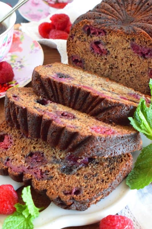 Loaded with fresh raspberries, this Raspberry Banana Loaf is the most moist and delicious loaf ever! Prepared with only a bowl and a spatula; no sifting or adding ingredients one at a time. Dump everything in a bowl, stir to combine, and bake. A loaf like this needs no frosting or fussing; serve thick slices with a hot tea or coffee! #banana #loaf #bread #raspberry #baking #raspberryloaf #onebowl