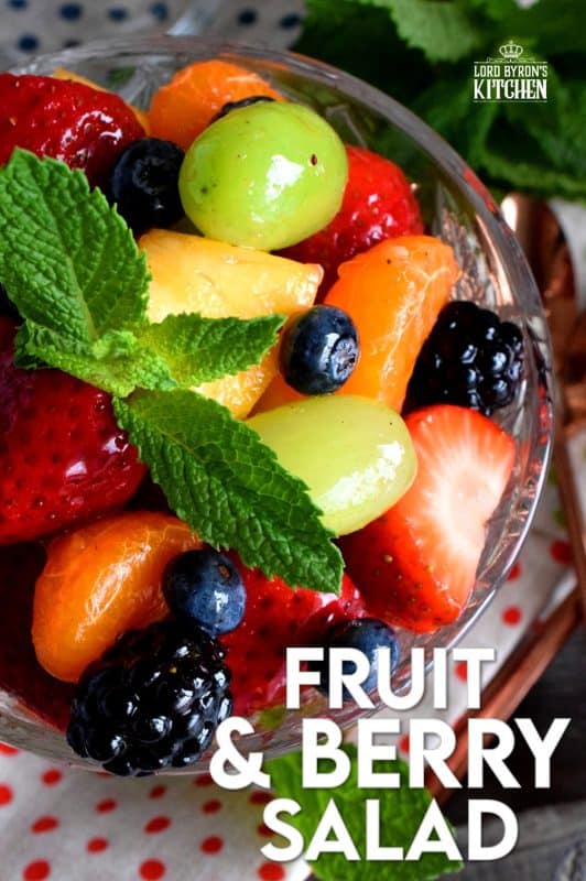 Fruit and Berry Salad is always best when comprised of fruit and berries that are currently in season, but there are certainly no die-hard rules; after all, rules were made to be broken! Use a sugar-free jelly to give your fruit that glossy, shiny look!! #fruitsalad #fruitbowl #choppedfruit #glazedfruitsalad #summerfruit #berries #fruitsandberries