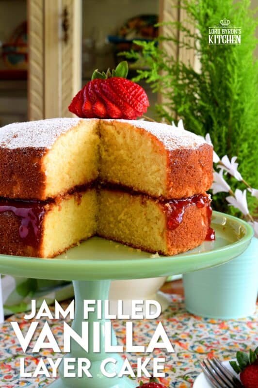 This gorgeous, easy-to-prepare, homemade Jam Filled Vanilla Layer Cake is not only delicious but also quite impressive! Although basic and rustic in presentation, this cake looks like a million bucks! No cake-decorating skills are needed for this beautiful showpiece! And, as a bonus, you can use your favourite jam flavour too! #jam #filling #cake #vanilla #easy #center