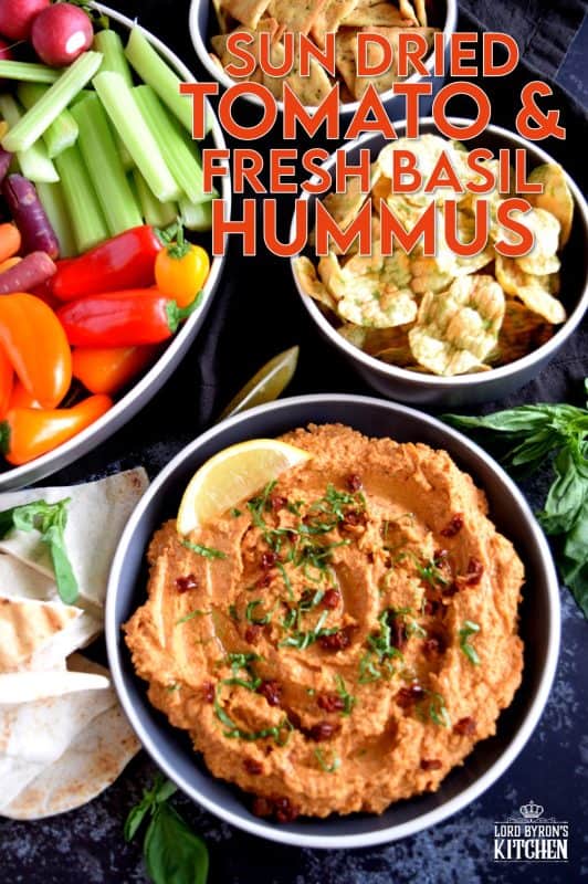 Homemade hummus is always best and it's easy too! All you need is a few basic ingredients to make this delicious Sun Dried Tomato and Fresh Basil Hummus. This one is savoury and slightly salty. And, the brightness from the fresh lemon juice is stellar! You'll never buy prepared hummus again! #hummus #dip #sundriedtomato #basil