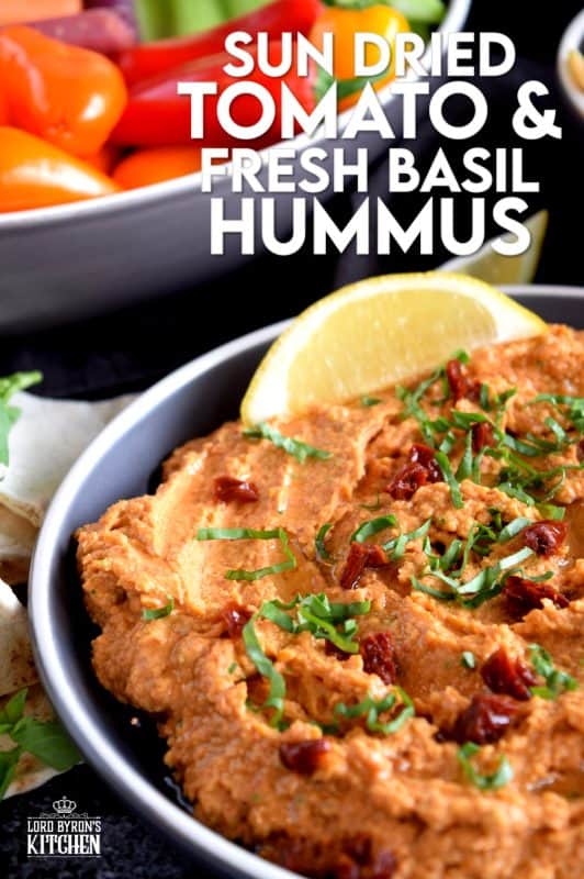 Homemade hummus is always best and it's easy too! All you need is a few basic ingredients to make this delicious Sun Dried Tomato and Fresh Basil Hummus. This one is savoury and slightly salty. And, the brightness from the fresh lemon juice is stellar! You'll never buy prepared hummus again! #hummus #dip #sundriedtomato #basil