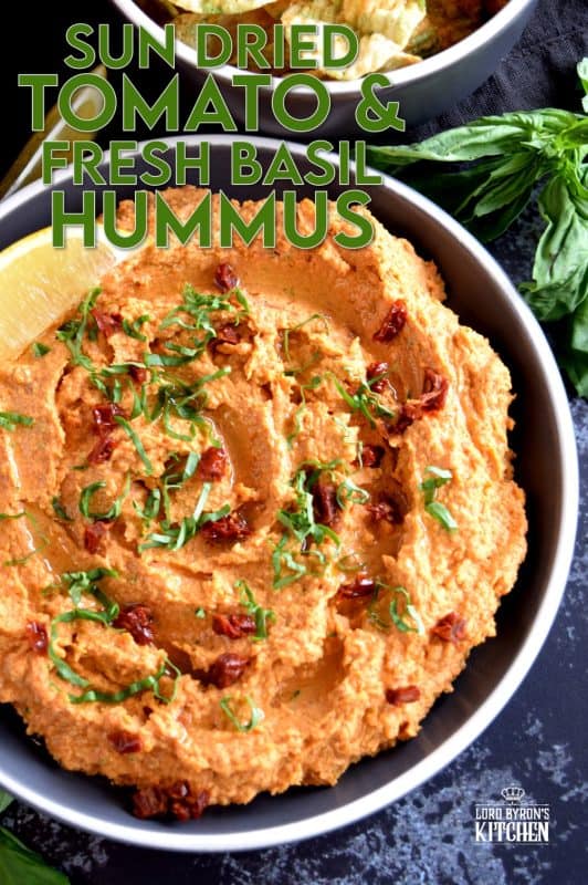 Homemade hummus is always best and it's easy too! All you need is a few basic ingredients to make this delicious Sun Dried Tomato and Fresh Basil Hummus. This one is savoury and slightly salty. And, the brightness from the fresh lemon juice is stellar! You'll never buy prepared hummus again! #hummus #dip #sundriedtomato #basil