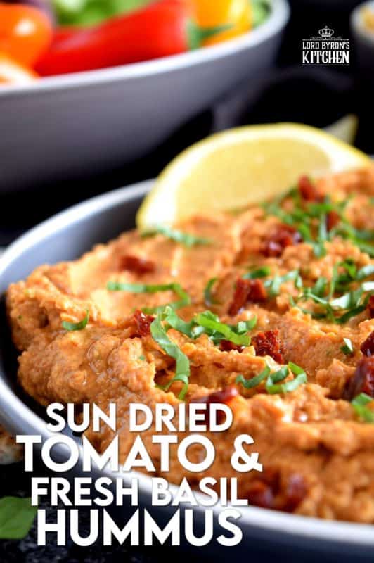 Homemade hummus is always best and it's easy too! All you need is a few basic ingredients to make this delicious Sun Dried Tomato and Fresh Basil Hummus. This one is savoury and slightly salty. And, the brightness from the fresh lemon juice is stellar! You'll never buy prepared hummus again! #hummus #dip #sundriedtomato #basil