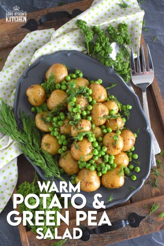 This warm salad consists of pillow-soft baby potatoes, bright green peas, and lots of fresh dill. These are tossed in a dressing prepared with olive oil, grainy mustard, champagne vinegar, and seasonings. Serve this dish anytime, because a really good potato salad is always a hit! #potatosalad #dill #babypotatoes #greenpeas #warmsalad