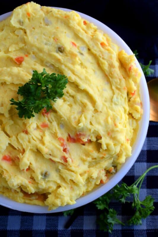 Mustard Potato Salad is very similar to regular potato salad, but with tang and zing from yellow mustard. Adding a vegetable medley consisting of peas, beans, corn, and carrots gives the salad more texture and flavour. Update your regular salad with a new flavour profile! #potato #salad #mustard #newfie #newfoundland #recipes
