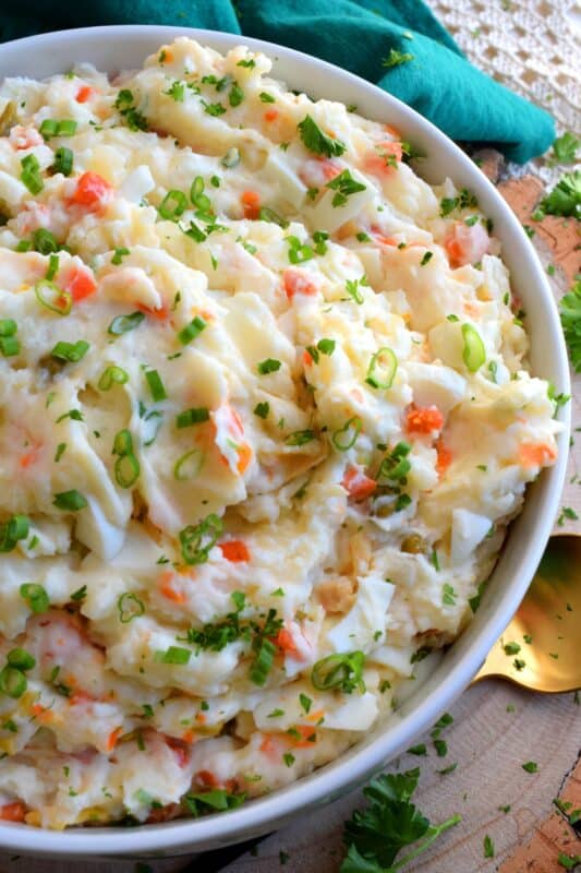 Made with chopped hard-boiled eggs, mashed potatoes, and green onions, Vegetable Potato Salad is creamy, comforting, and oh so delicious! The addition of eggs and green onions might not be the makings of a traditional Newfoundland potato salad in your home, but it surely is in mine! You've got to try this version! #potato #salad #newfie #Newfoundland #recipes #vegetable