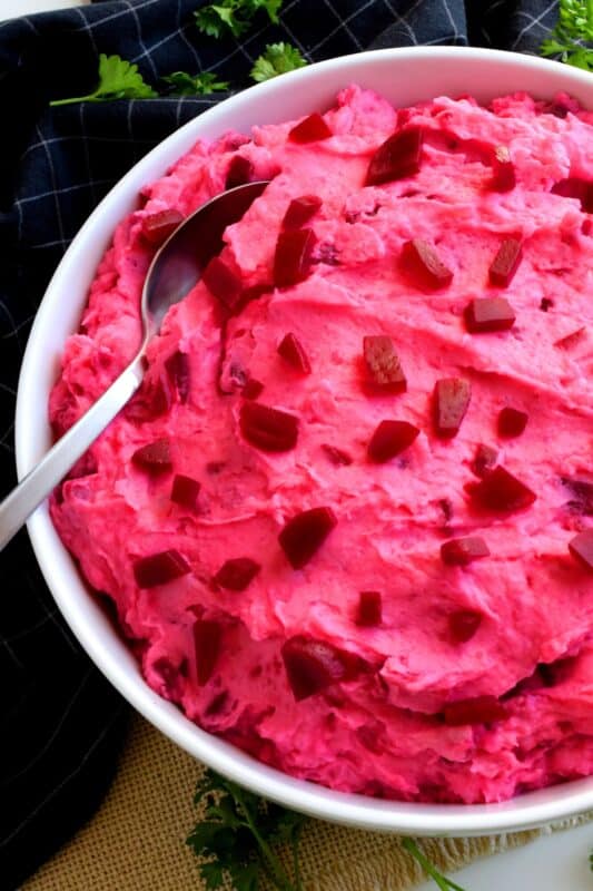 Pickled Beet Potato Salad is a sweet and creamy side dish paired perfectly with chicken or roast beef; a perfect summer potluck take-along side dish! Vibrantly pink and quite frankly, a bit odd, but super delicious and a conversation starter too! What more could you ask for in a potato salad? #pickled #beet #potato #salad #potatosalad #pinkfood