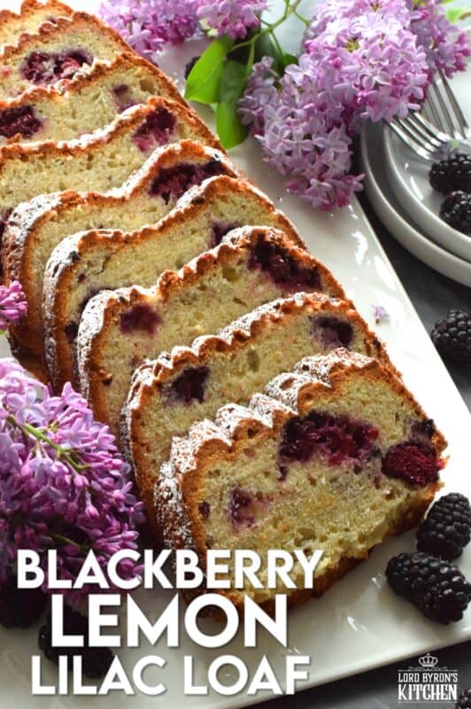 A super moist loaf prepared with fresh blackberries, lemon juice and zest, and hand-picked lilac petals. Not only is this Blackberry Lemon Lilac Loaf delicious and pretty, it is also quite fragrant! If you are fond of the smell of lilacs in early summer, this dessert is sure to please! #edibleflowers #lilacs #loaf #lemon #blackberry #lemonloaf #lilac